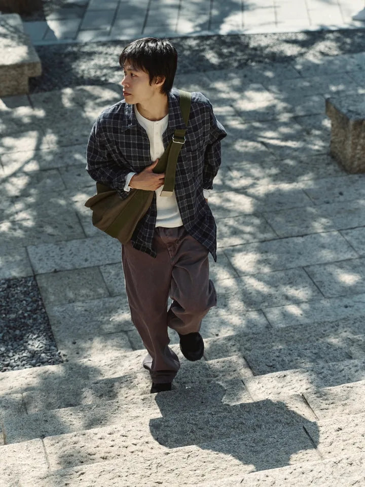 

A check shirt and purple denim between sun and shade — 1