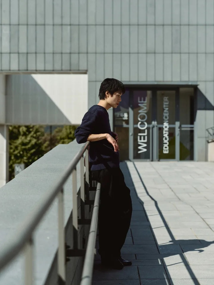 

A navy V-neck and black chinos on a clear afternoon — 2